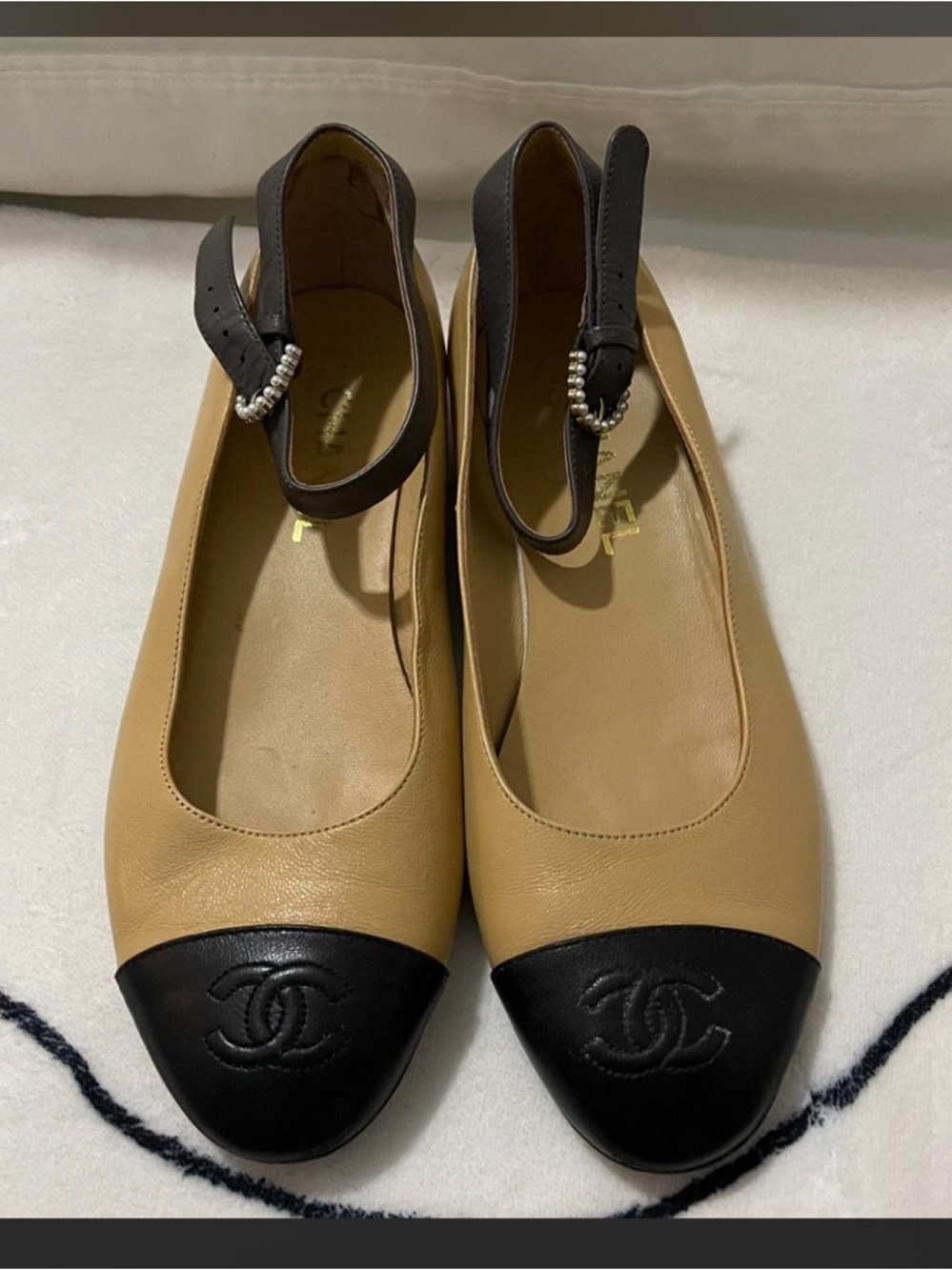 CHANEL Two-Tone Leather Slingback Flats in Beige and Black